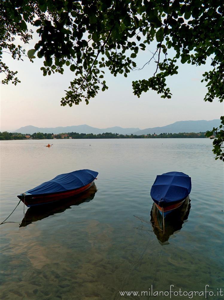 Cadrezzate (Varese, Italy) - Two boats moored in Lake Monate at darkening